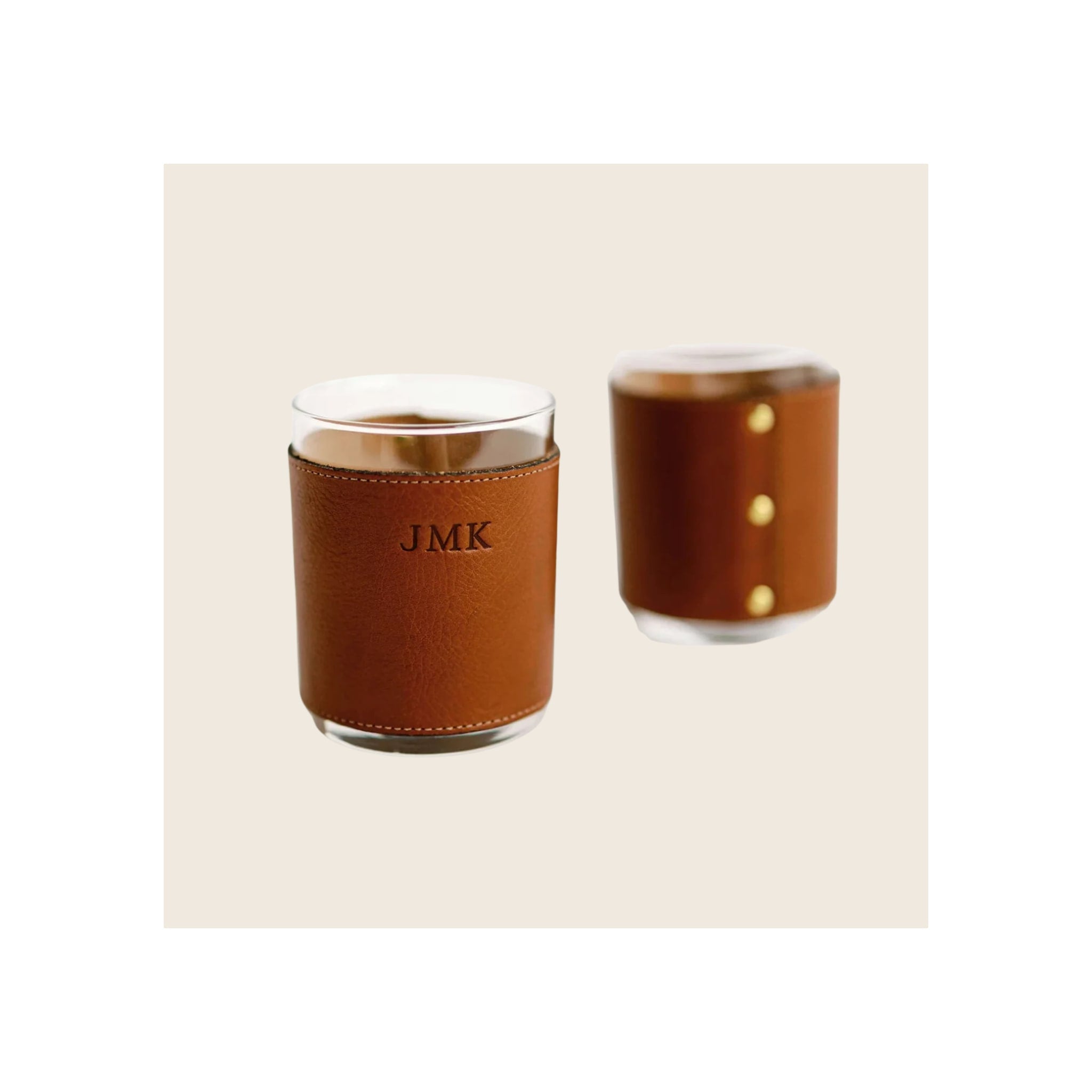 Rocks glasses set of two with tan leather sleeve, brass studs, and stitched detailing