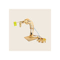 Wooden robotic arm kit assembled, natural birch finish, extended claw gripping yellow block, with hydraulic syringe controls