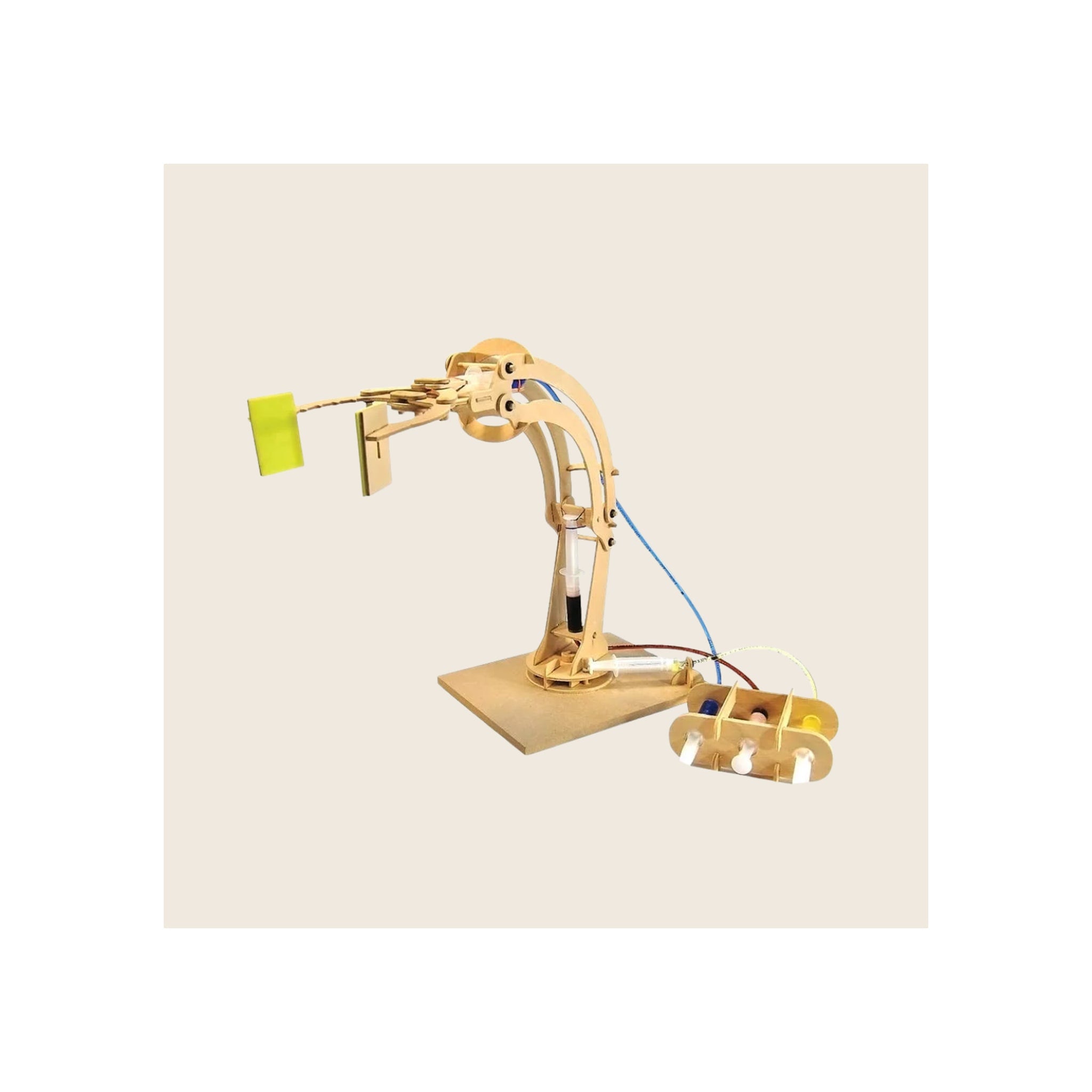 Wooden robotic arm kit assembled, natural birch finish, extended claw gripping yellow block, with hydraulic syringe controls