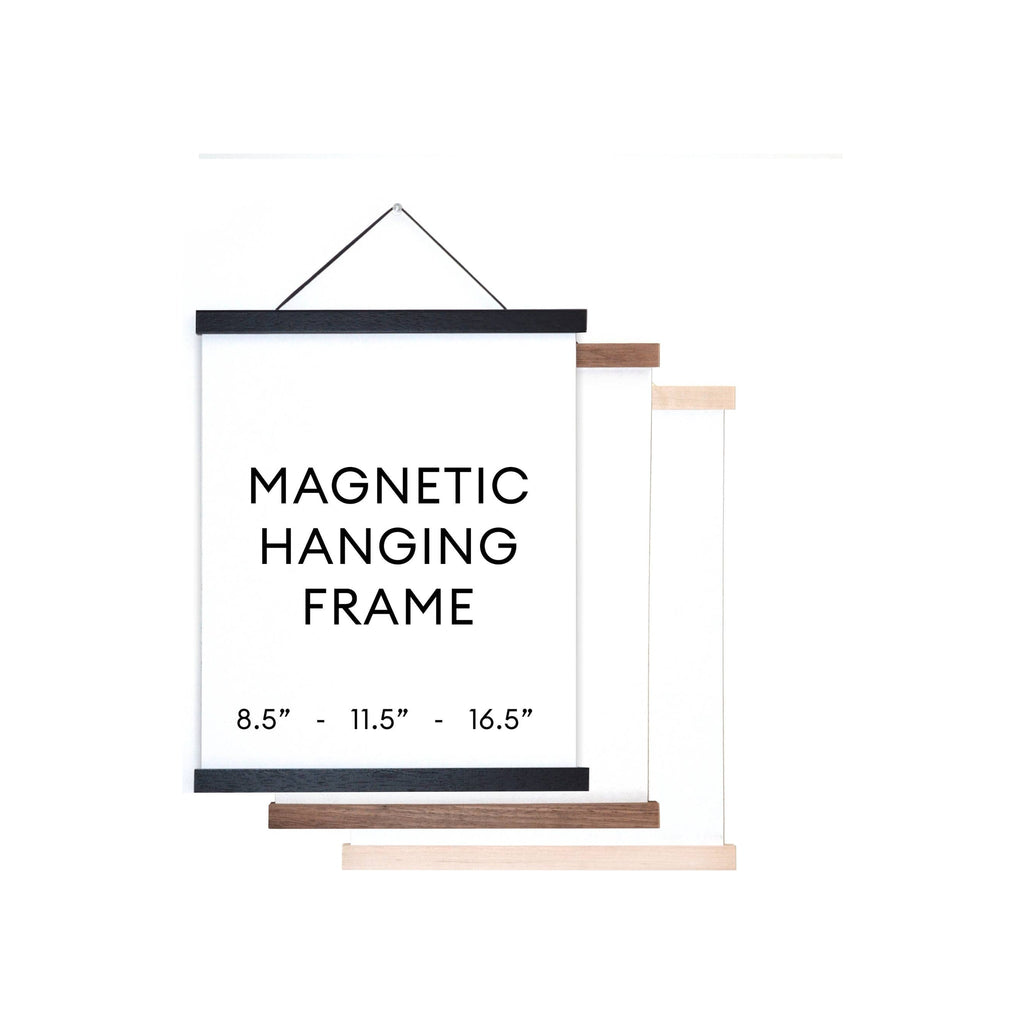 Magnetic hanging frame set in black, walnut, and natural wood finishes, portrait orientation on white background