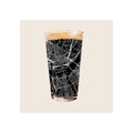 Pint glass with black Cincinnati city map etching, filled with dark beer and foam head