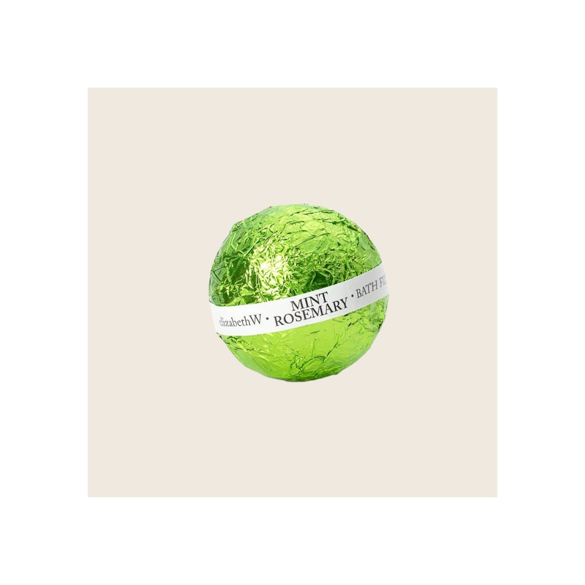 Bath fizz ball wrapped in bright green metallic foil with white branded belly band