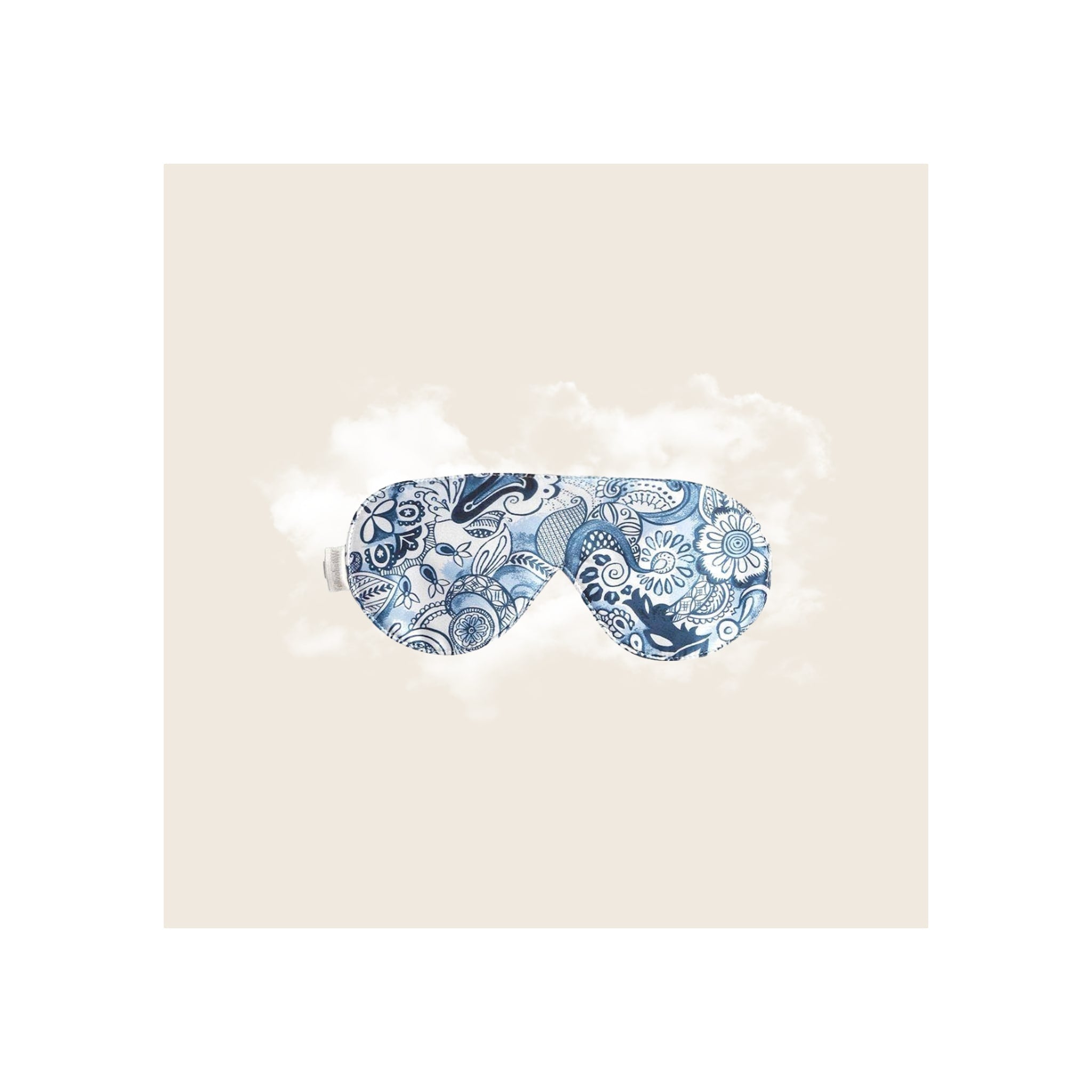 Sleep mask in blue and white Delft-style paisley floral print, front view, flat lay