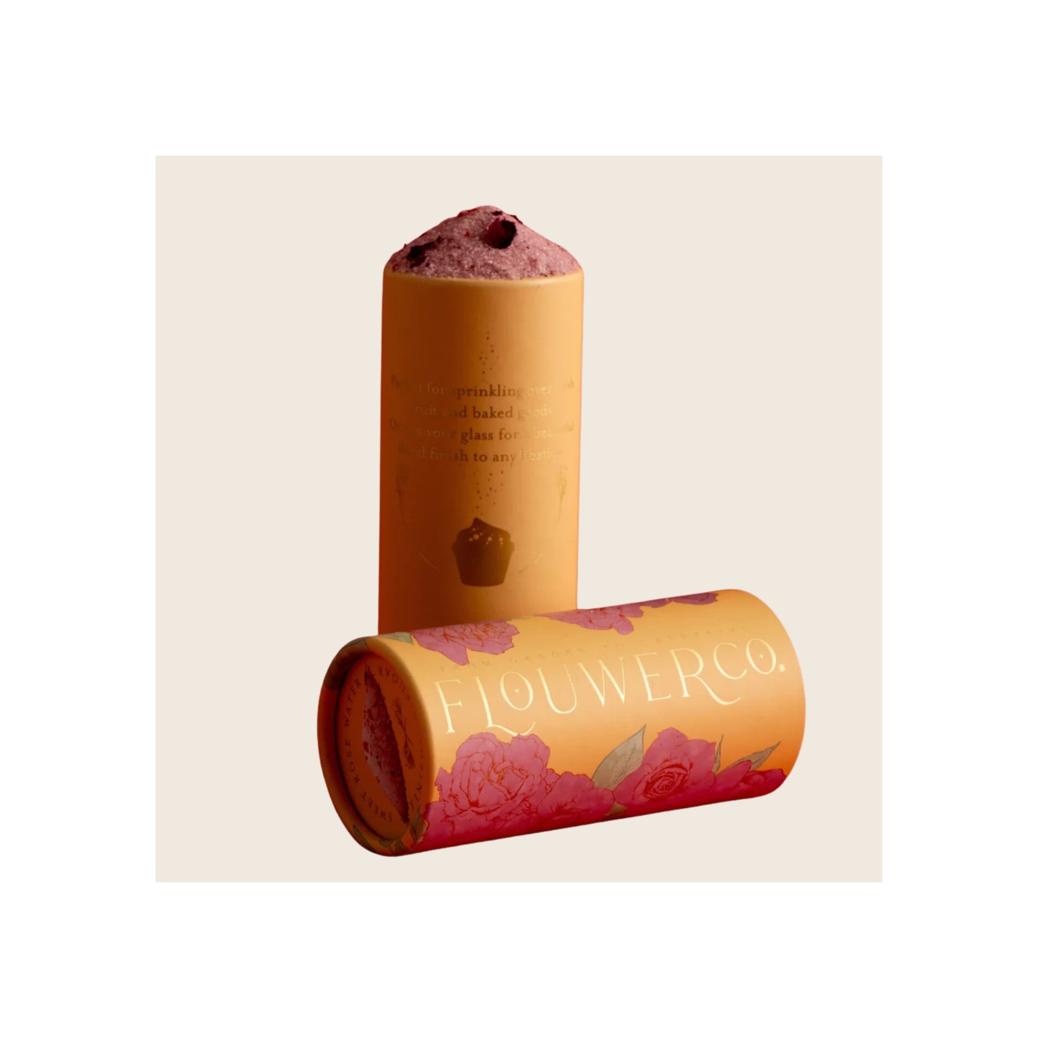 Finishing Sugar Sweet Rose two amber cylindrical tubes with pink floral label, one upright one lying flat