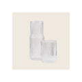 Ribbed clear glass carafe and matching tumbler, vertical ribbed texture, upright front-facing orientation