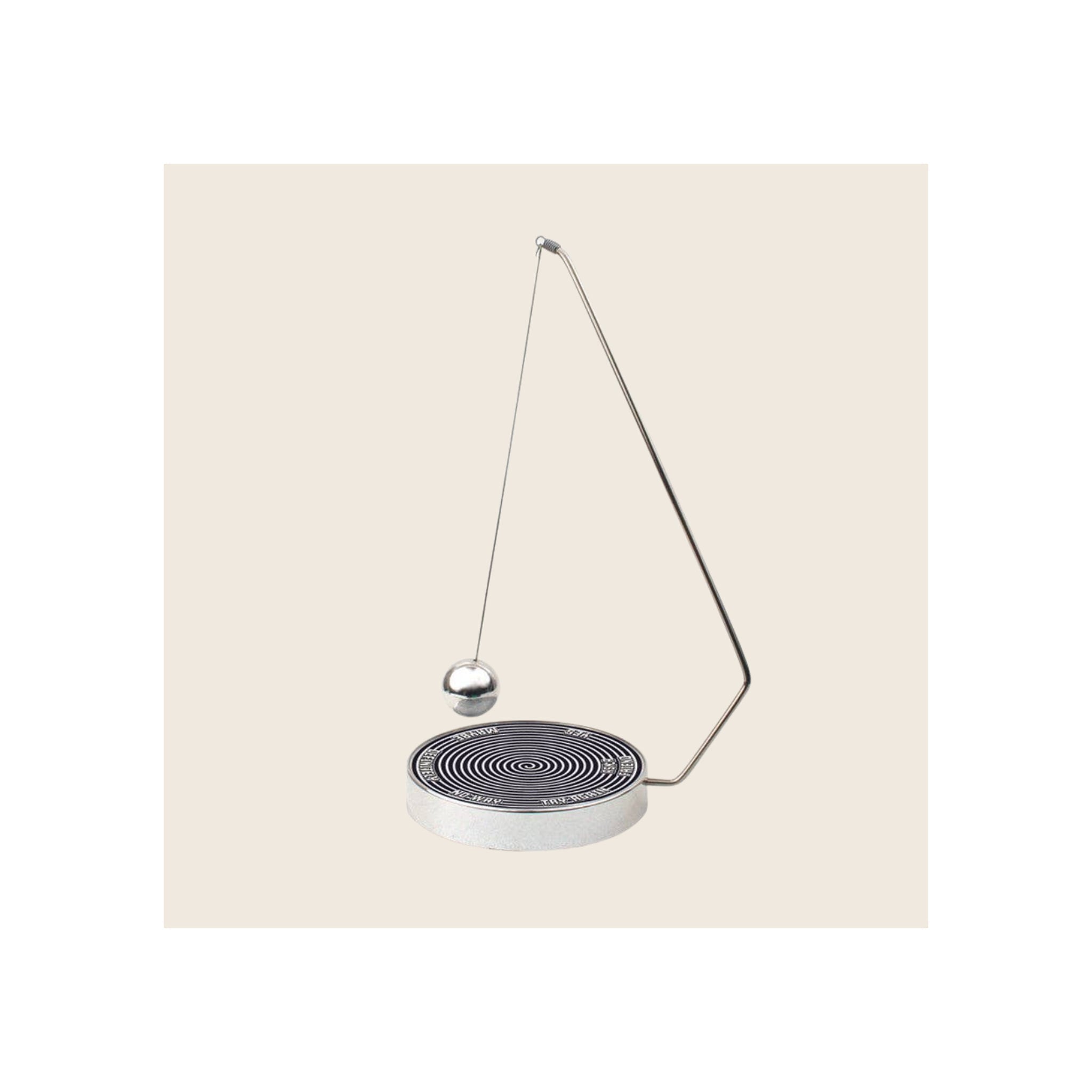 Decision Maker pendulum toy, silver metal frame and ball, black spiral-patterned circular base, angled upright