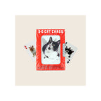 Lenticular cat playing cards deck in red packaging with two sample cards fanned out