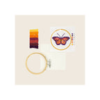 Cross stitch embroidery kit with butterfly pattern card, wooden hoop, aida fabric, and multicolor thread skeins