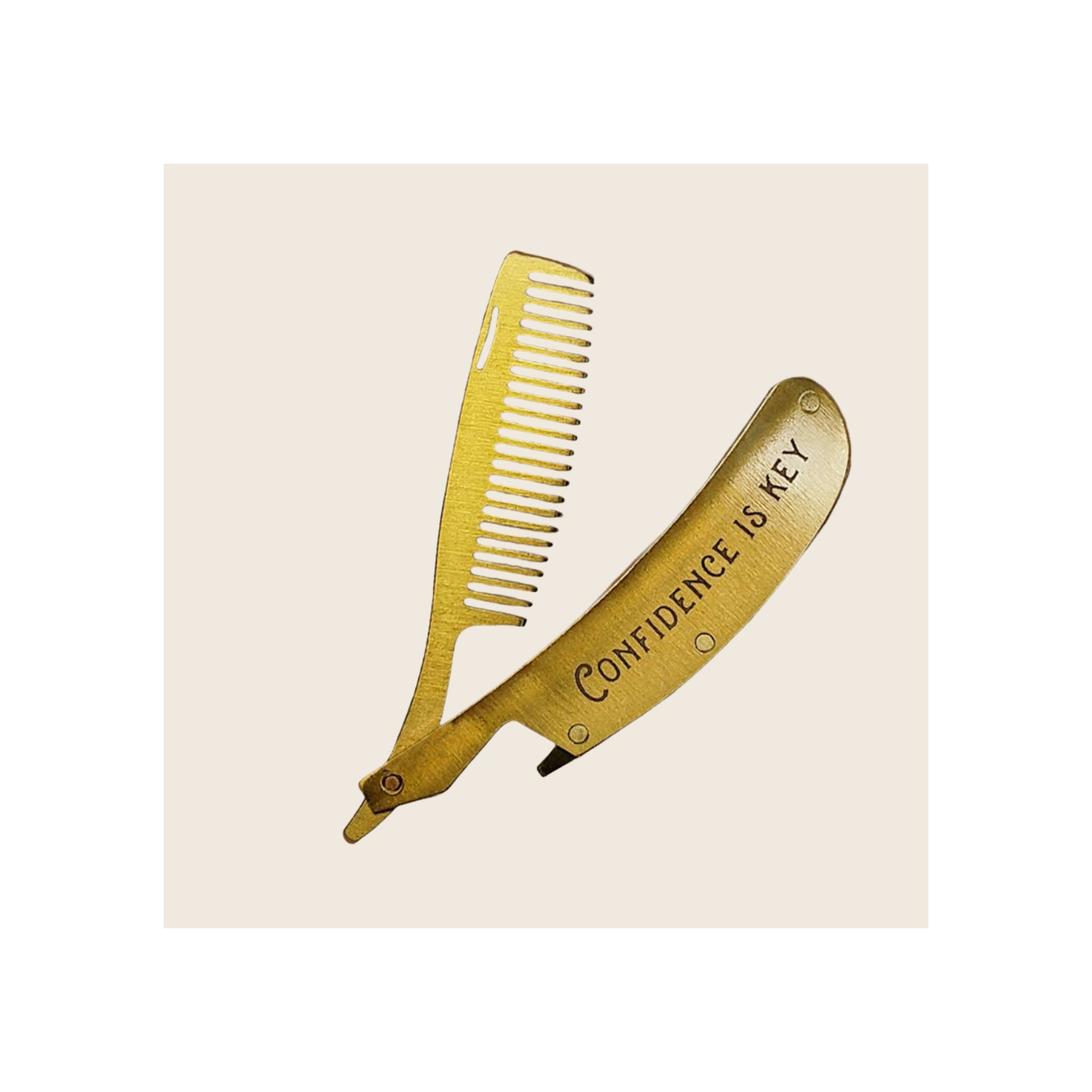 Folding beard and mustache comb, gold-tone brushed metal, open position showing teeth