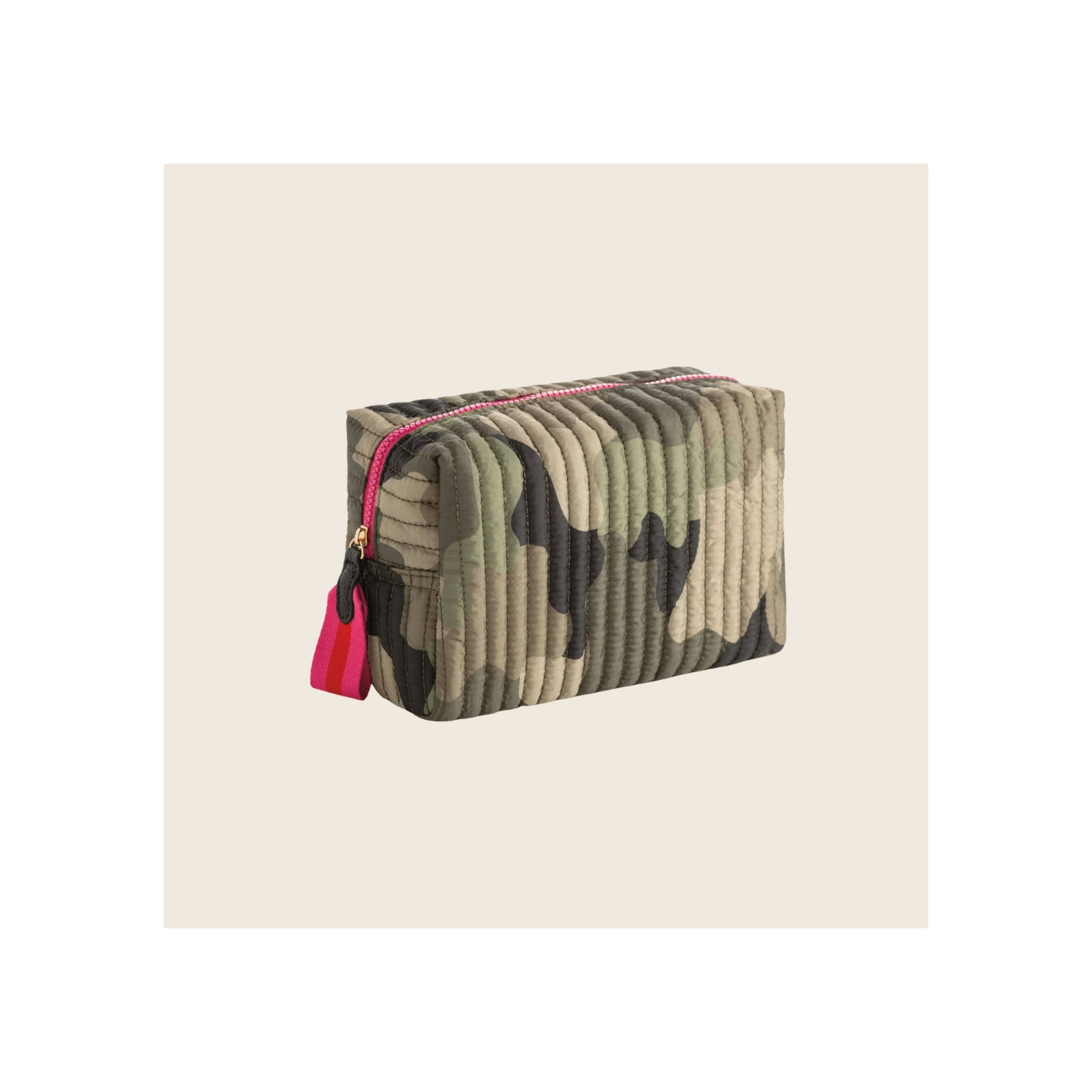 Cosmetic pouch in quilted camouflage fabric with hot-pink zipper and pull tab, angled three-quarter view
