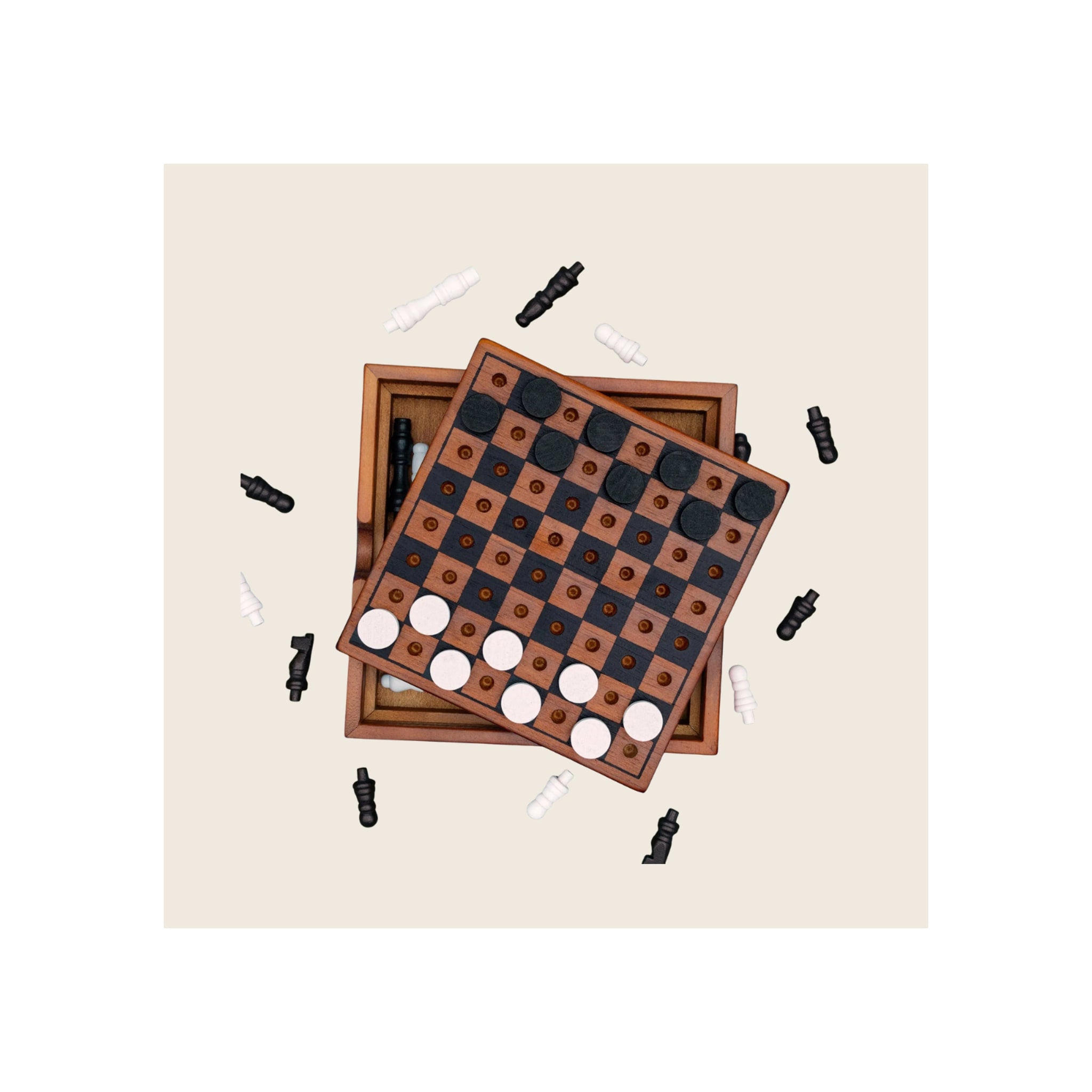 Wooden chess and checkers game set, two stacked boards top-down view, black and white pieces scattered around