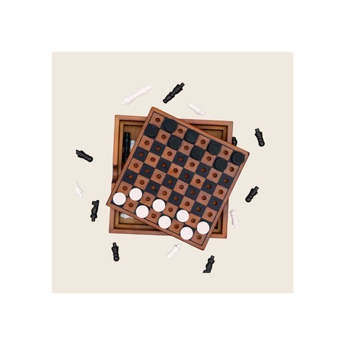 Wooden chess and checkers game set, two stacked boards top-down view, black and white pieces scattered around