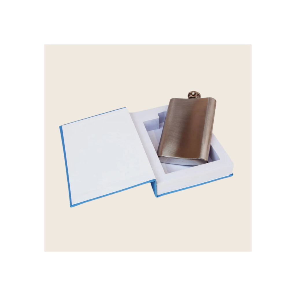 Flask in open book-shaped box, brushed stainless steel, blue-edged white interior, angled view
