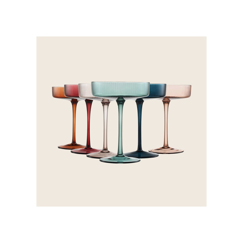 Set of six ribbed coupe glasses in multicolor pastel tones, arranged in a fan formation