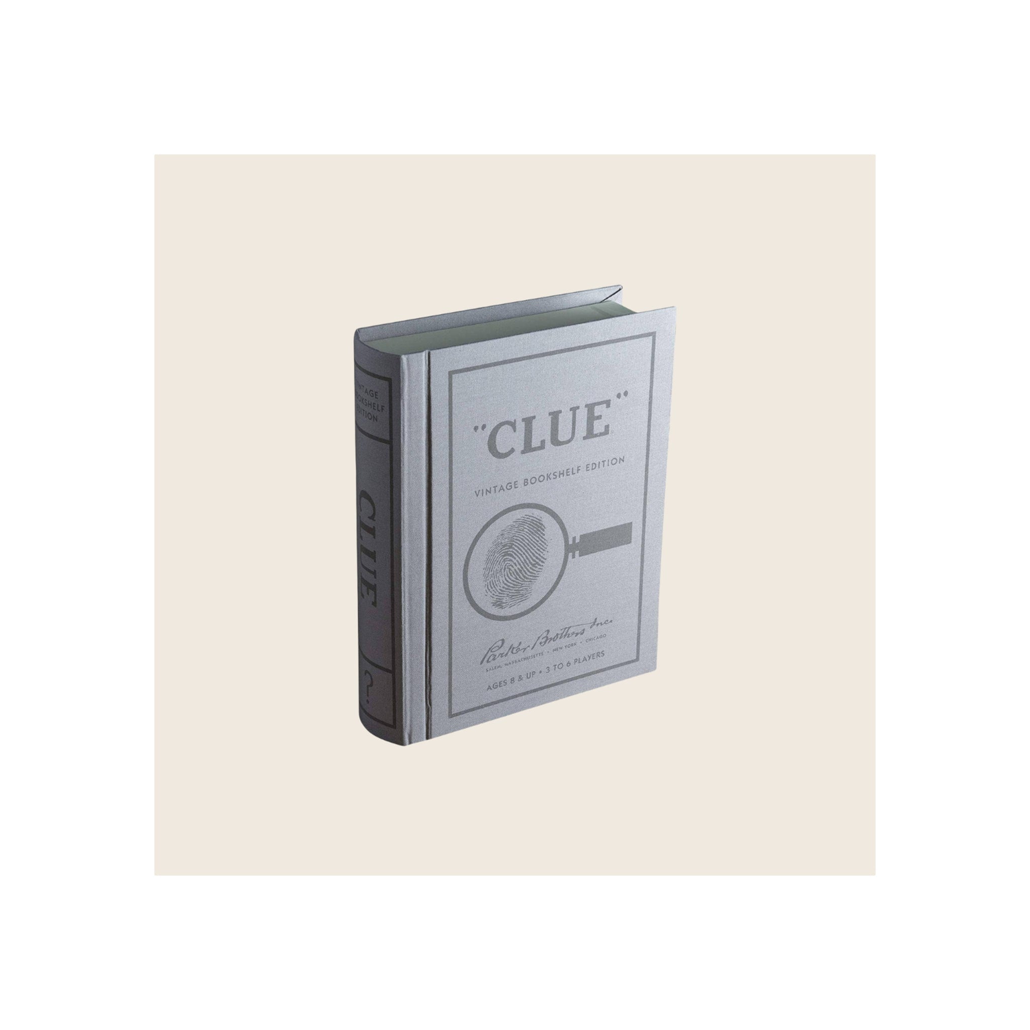 Clue Vintage Bookshelf Edition board game box, gray linen-textured hardcover book format, angled front-and-spine view