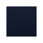 Macro fabric swatch of deep navy bouclé showing dense nubby looped texture and rich blue tone