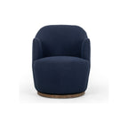 Drum-style swivel chair in navy bouclé upholstery, straight-on front view with open arm silhouette