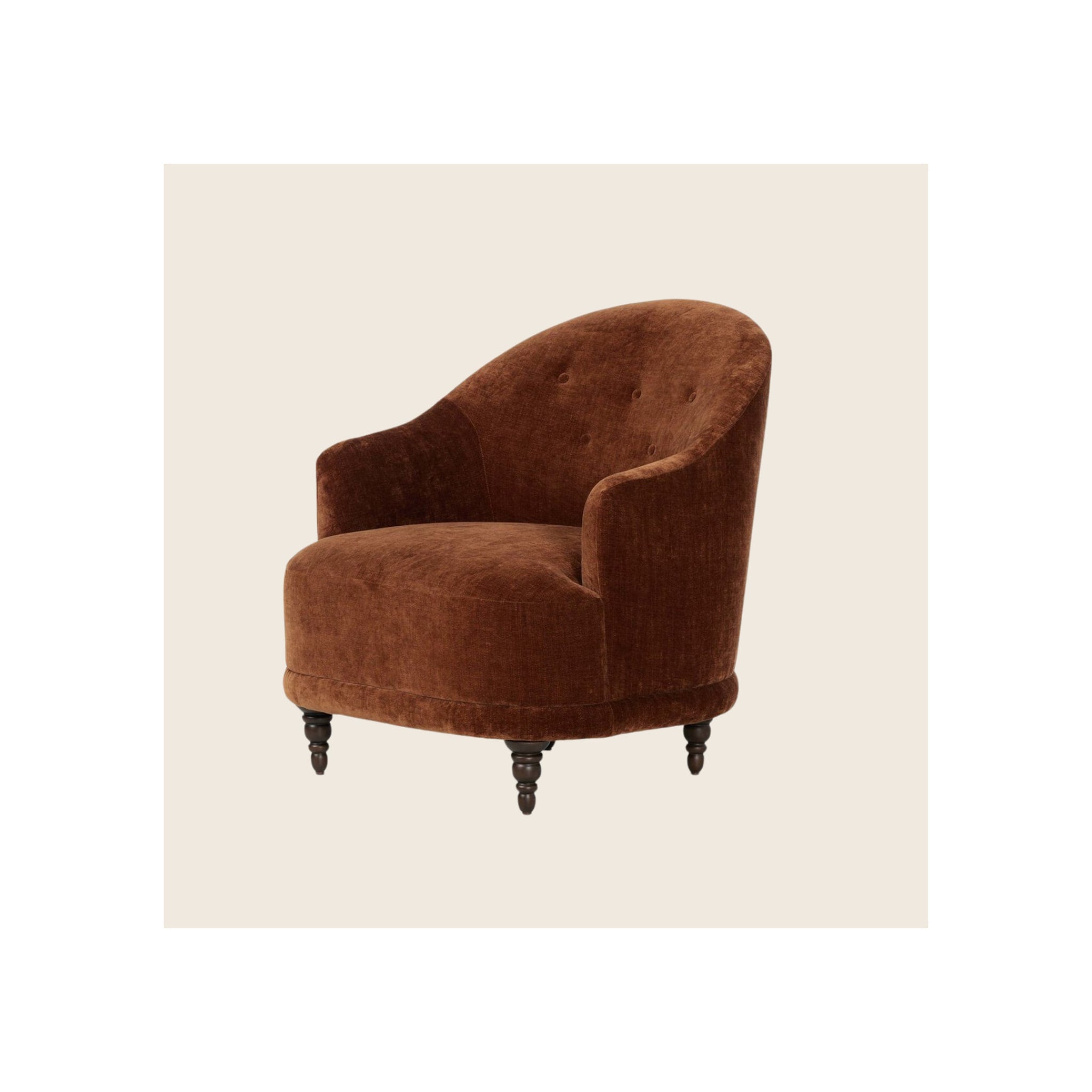 Armchair in rust-brown velvet with button-tufted back, curved barrel silhouette, dark turned wood legs, angled three-quarter view