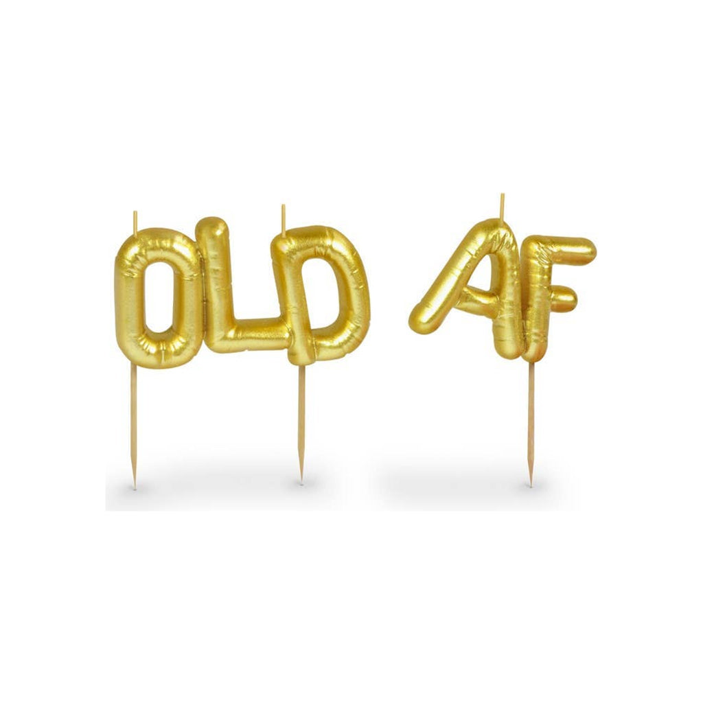 Party candles spelling OLD AF in gold metallic balloon-style letters on wooden picks