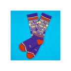 Socks, purple knit crew length with red-orange heel and toe, cream and red stripes, bold text graphic