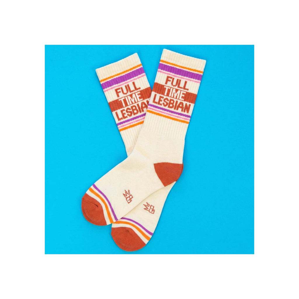 Socks, cream ribbed crew length, purple orange pink stripes, terracotta toe and heel, "Full Time Lesbian" text knitted in