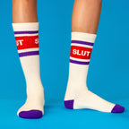 Crew socks white ribbed knit with purple stripes red band and purple toe worn on legs