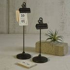 Two black metal clip-on stands, tall and short, with binder-clip tops on round bases