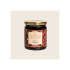 Glass jar of bourbon-infused boozy cherries, gold metal lid, dark red label, upright front view
