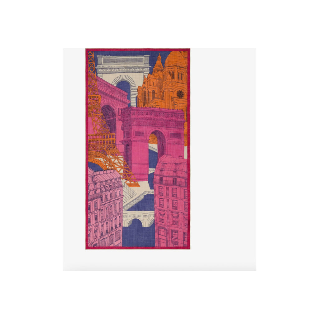 Scarf laid flat, fuchsia pink and navy Paris landmarks print with orange and cream accents, red border edge
