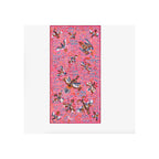 Scarf laid flat, fuchsia pink with multicolor bird and floral print, dark border edge