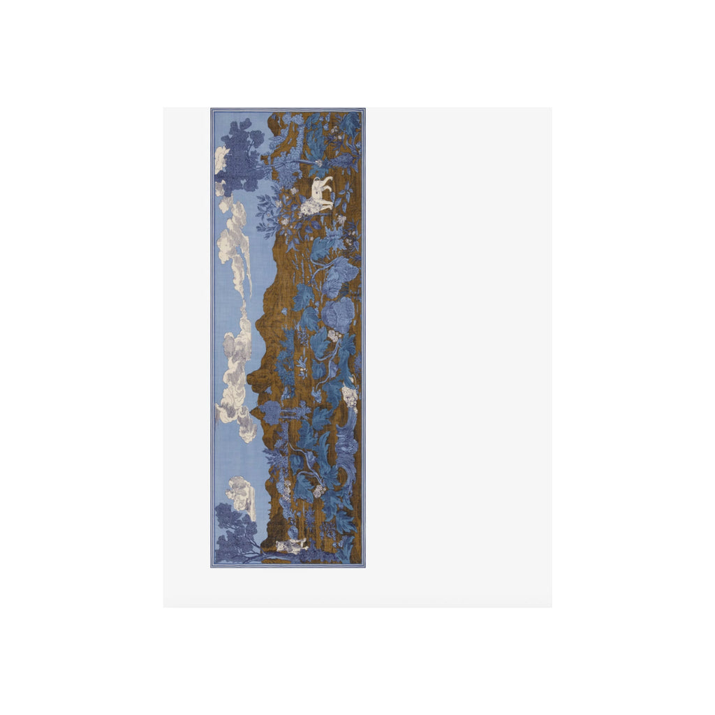 Scarf laid flat, blue and brown botanical print with clouds and monkey motif