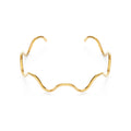 Squiggle cuff bracelet, gold-tone polished metal, open-ended double wave design, front view
