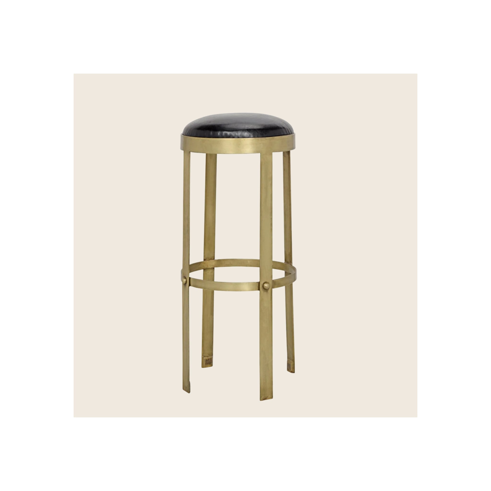 Bar stool with round black leather seat, antique brass metal frame and circular footrest