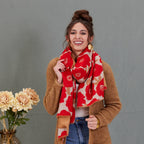 Scarf, red and beige large poppy print, reversible wrap style, draped around model's neck