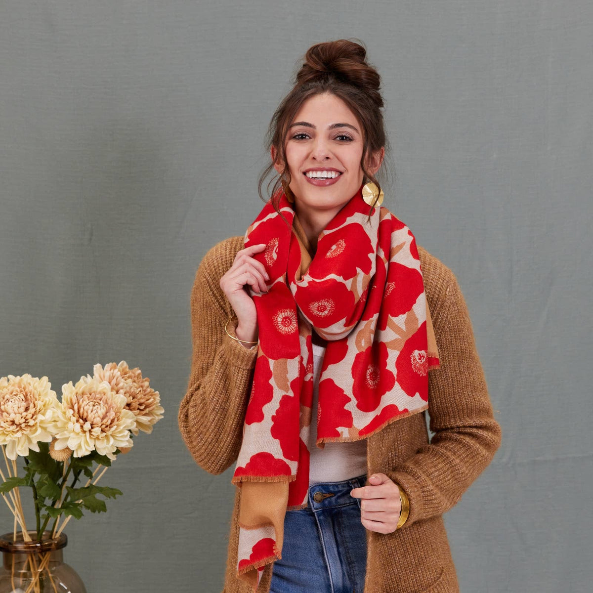 Scarf, red and beige large poppy print, reversible wrap style, draped around model's neck
