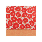 Scarf with bold red poppy floral print on cream ground, reversible peach side visible at hem with fringe edge