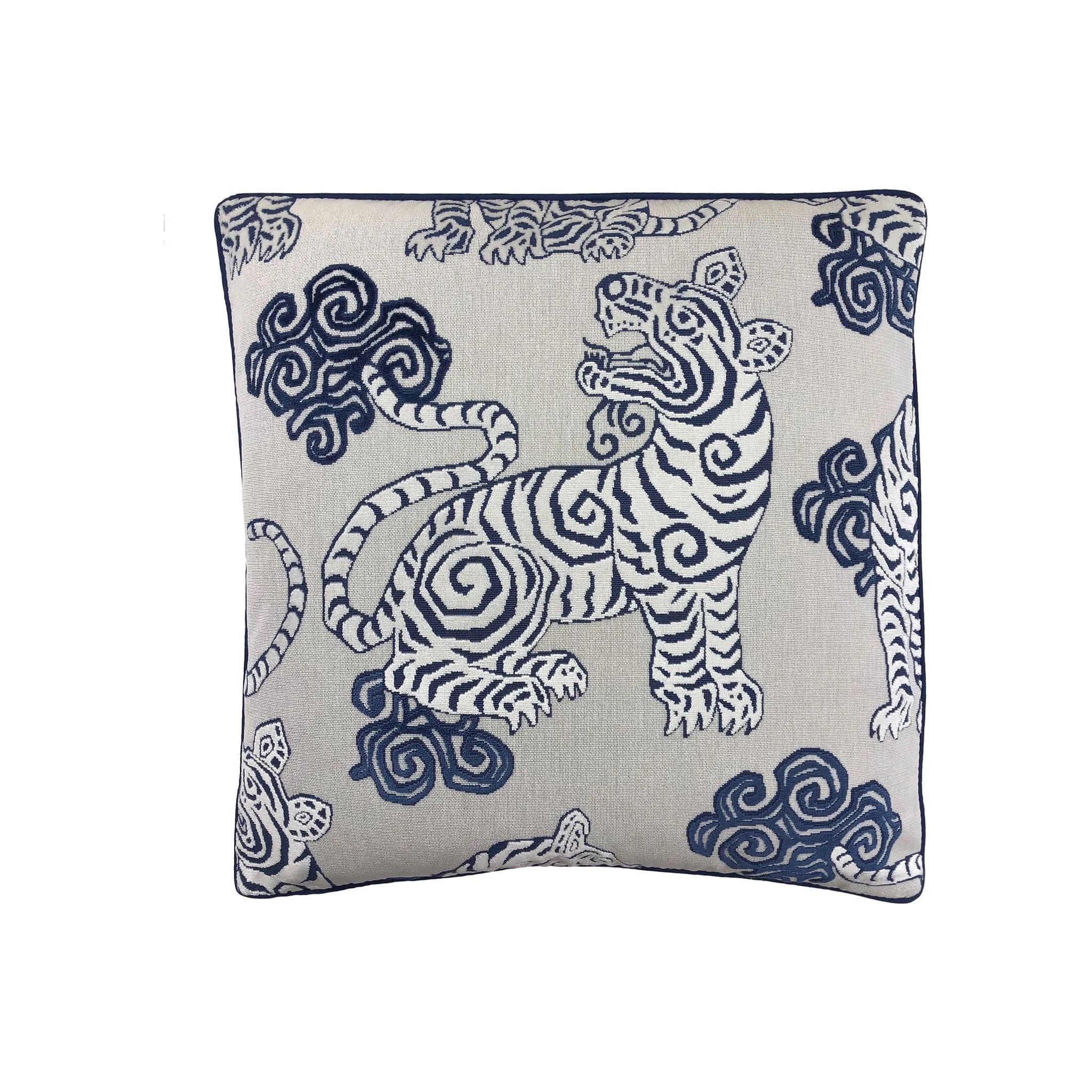 Cushion with navy blue Tibetan tiger and cloud motif on off-white linen, navy piped border, square format