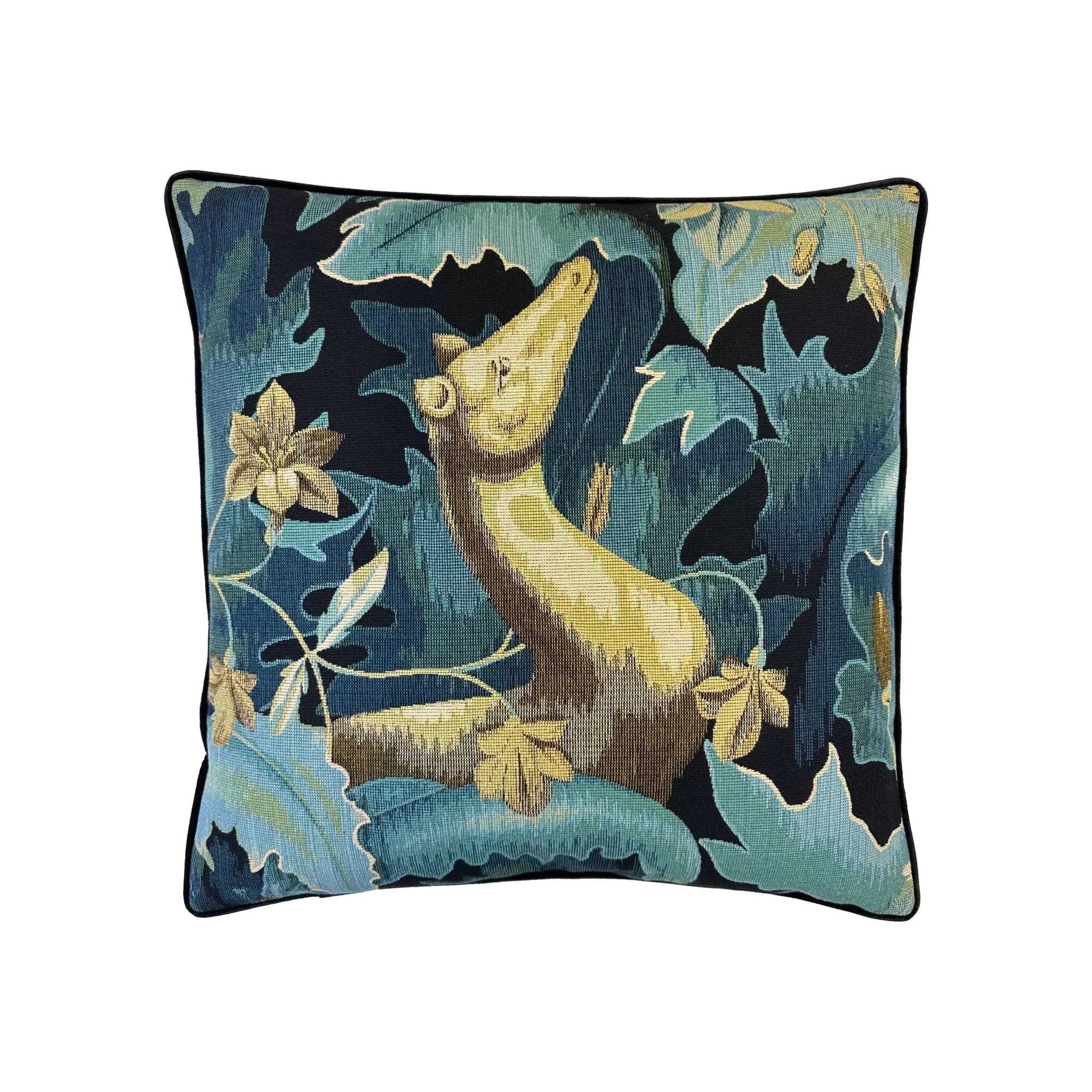 Cushion with tapestry-style woven otter amid teal and navy botanical foliage, black piped border
