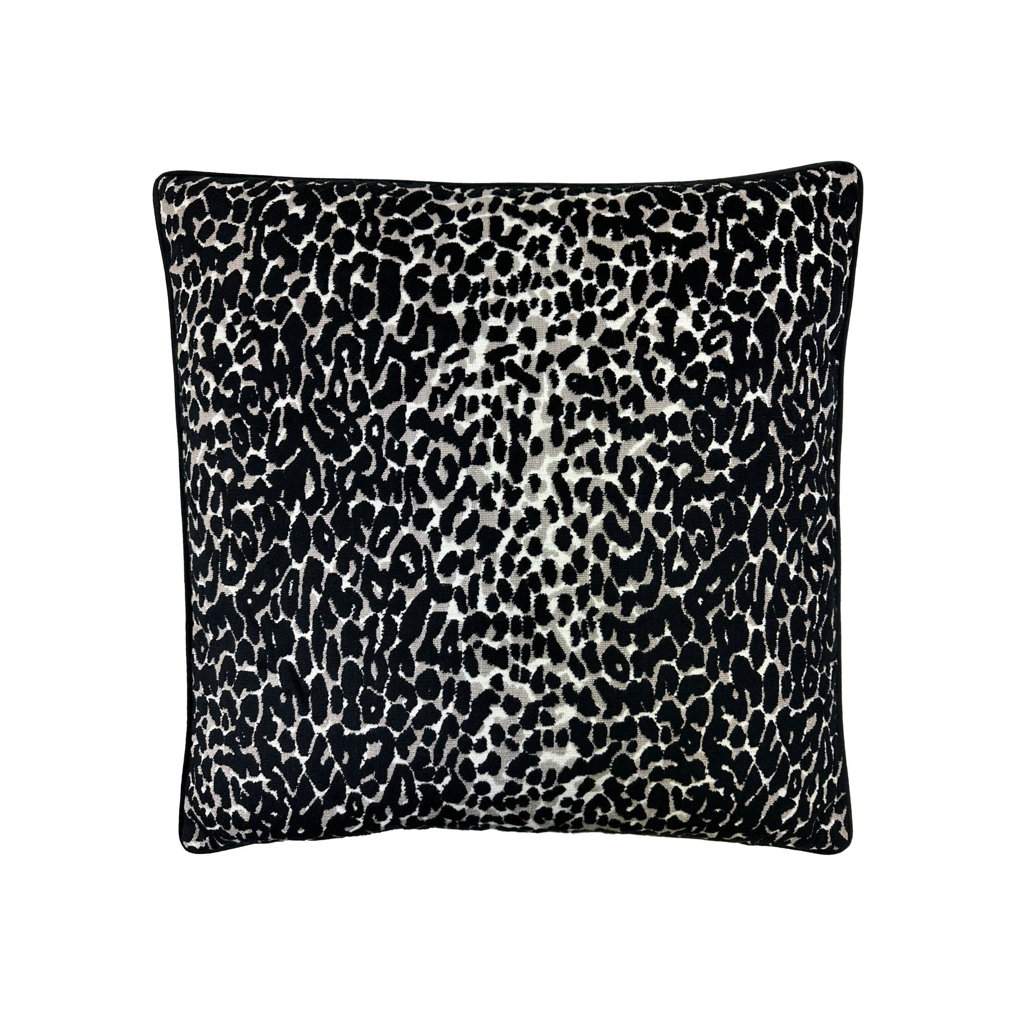 Cushion in black and white leopard-print woven fabric with black piped border, front-facing flat lay