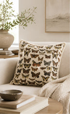 Throw pillow cream linen butterfly botanical print square on sofa