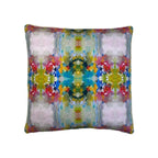 Decorative cushion with multicolour abstract mirrored floral print and piped edges, front-facing