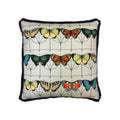 Cushion with multicolour butterfly print and black fringe trim, front view