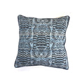 Cushion with blue and black woven tiger motif pattern and navy piped border