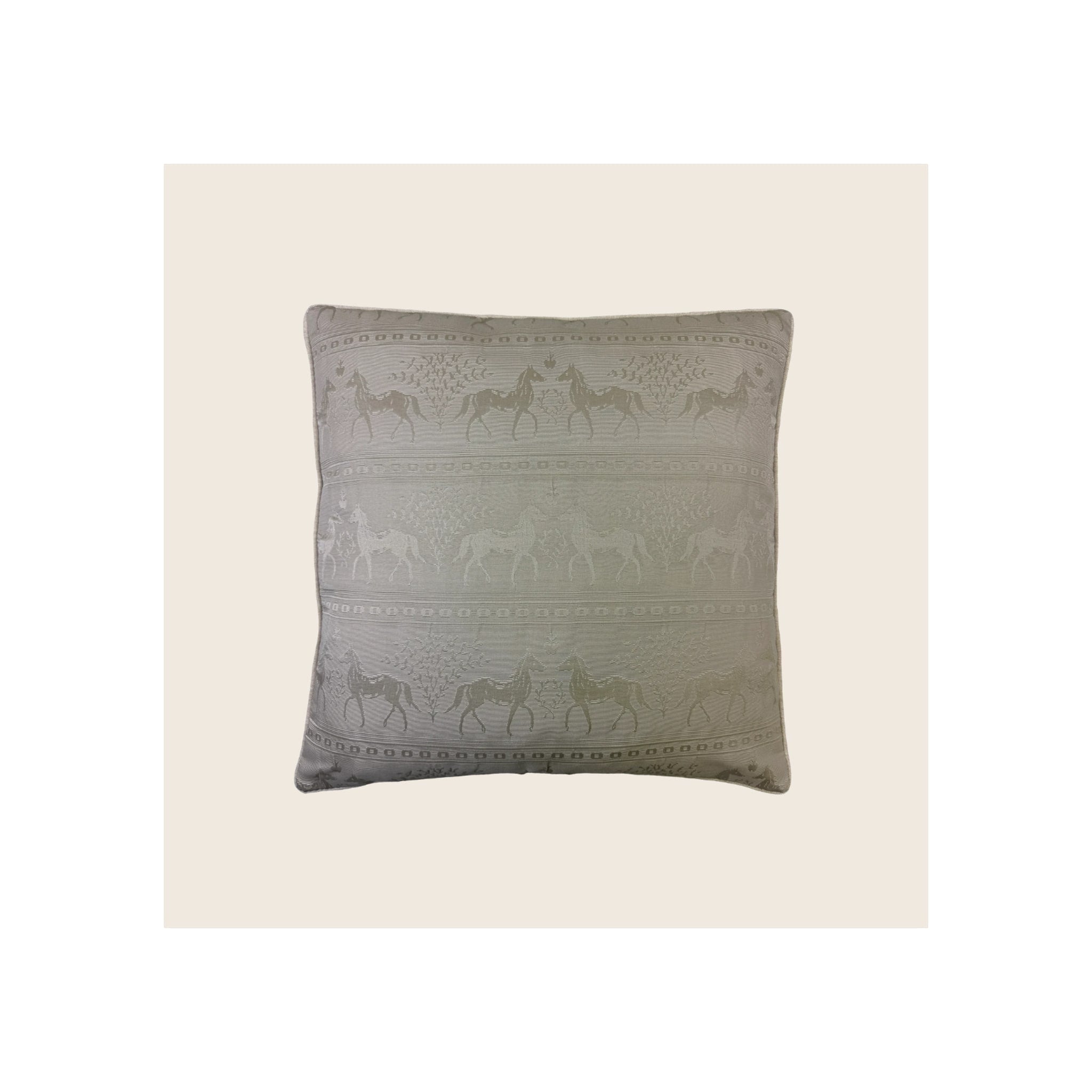 Cushion cover in sage green jacquard fabric with repeating horse and botanical stripe pattern