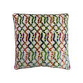Cushion with multicolour snake pattern on cream woven fabric, piped edge, front-facing