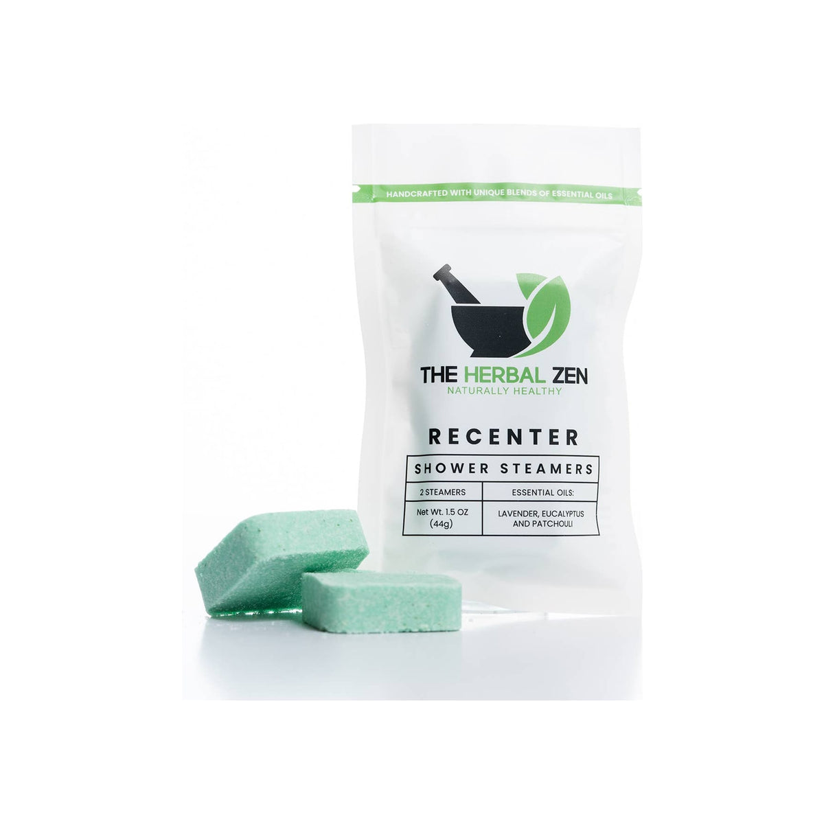 Shower steamer 2-pack in white resealable pouch with two green square tablets in front