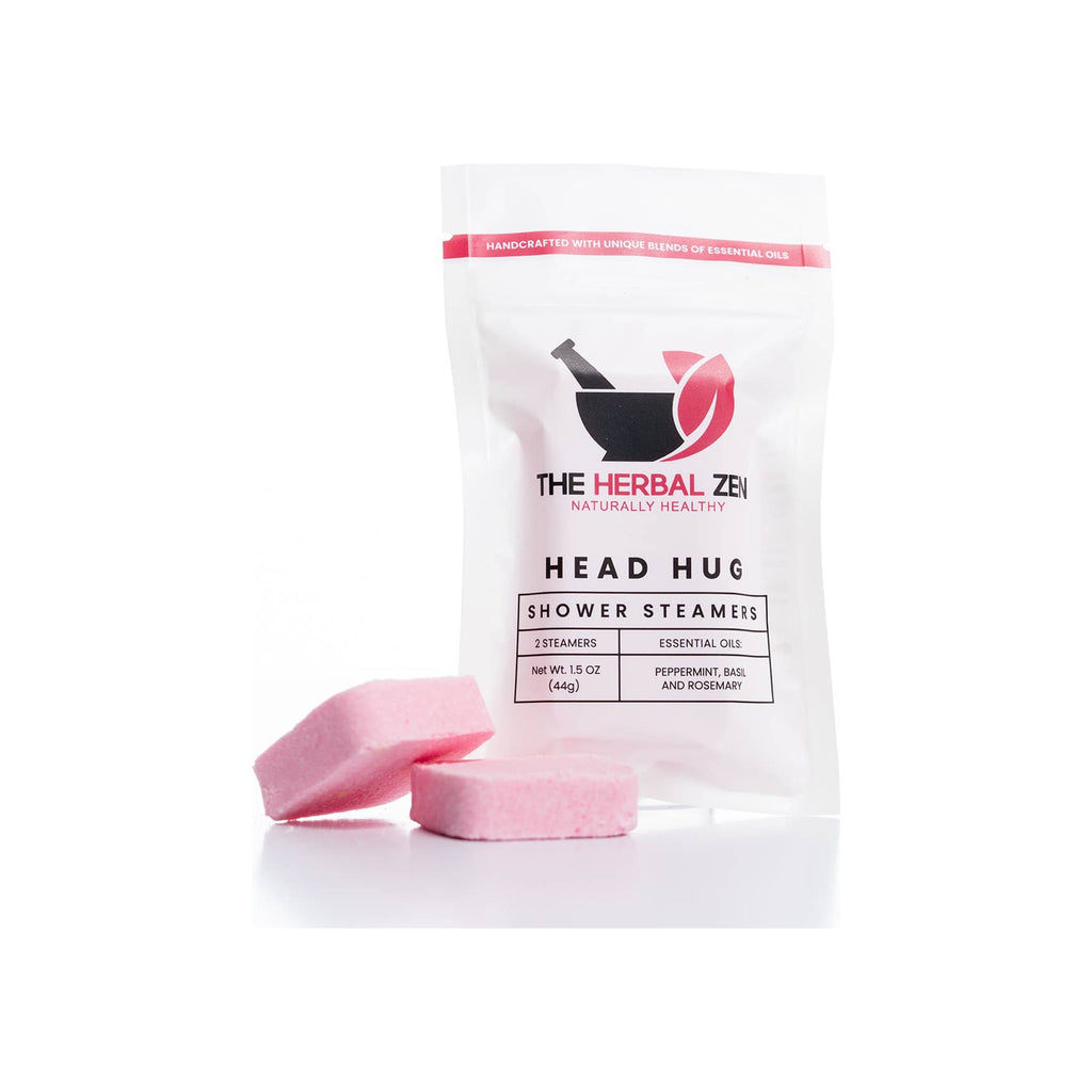Shower steamer 2-pack in white resealable pouch with two pink tablet steamers placed in front