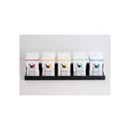 Five Herbal Zen shower steamer pouches in white packaging displayed upright in black tray, front-facing