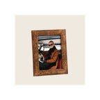 Photo frame in burl wood finish, angled portrait orientation, displaying lifestyle insert photo
